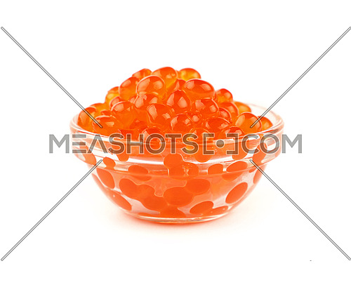 Close up glass bowl of salmon fish red caviar isolated on white background, low angle side view