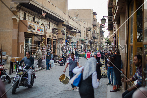people and streets in the old town with traditional street stores in the Middle East