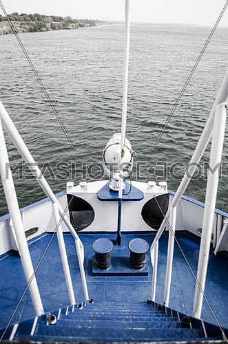 A front deck of a boat in light blue