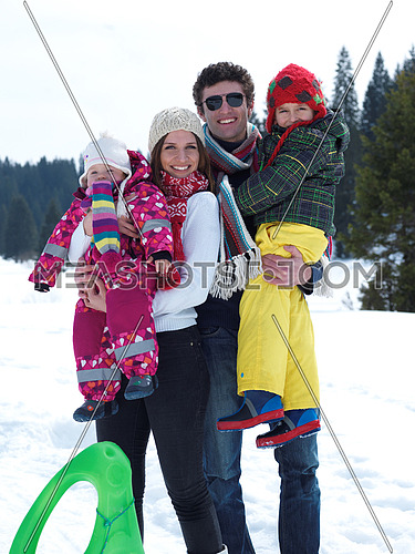 Winter playing, fun, snow and family portrait  sledding at winter time