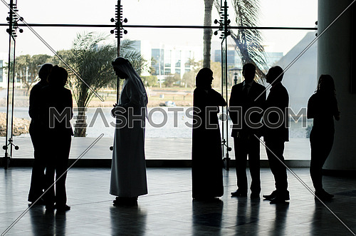 group of people standing in a business meeting