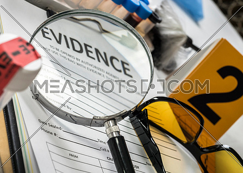 Basic research utensils with a evidence bag in Laboratory forensic equipment, conceptual image