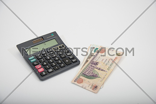 black calculator and egyptian money
