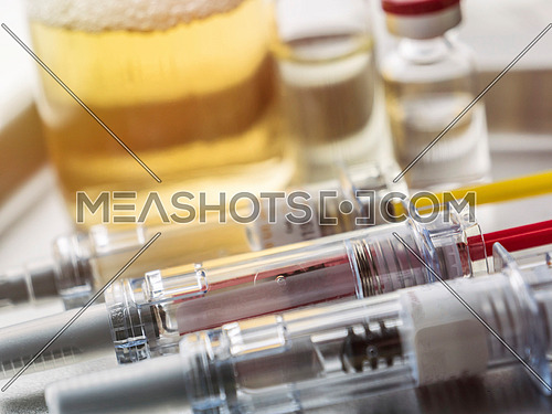 Medicine in vials and syringe ready for vaccine injection