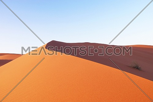 Long shot for Sand dunes in Saudi desert by day.