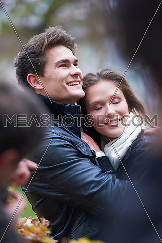 romantic young couple have fun in city park at autumn season