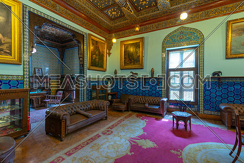 Manial Palace of Prince Mohammed Ali. Living room at the residence building with Turkish floral blue pattern ceramic tiles, vintage furniture, European style paintings, Cairo, Egypt