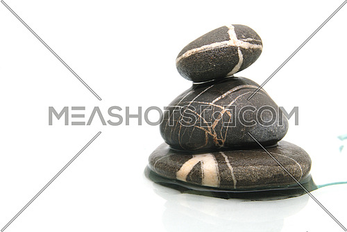 wet zen stones on a white background