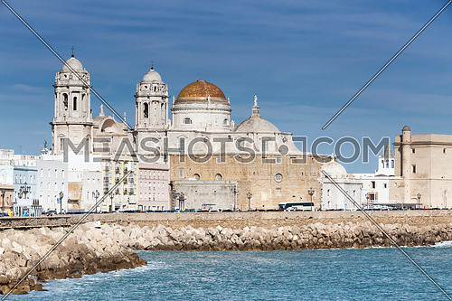 Cadiz, Spain - March 31: Panoramic view of the city on March, bordered by the Mediterranean sea and its Cathedral, called Catedral Nueva by locals, in the background, take in Cadiz, Andalusia, Spain