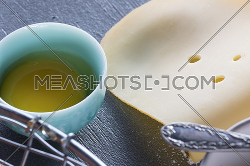 Gouda cheese and yolk in a blue bowl
