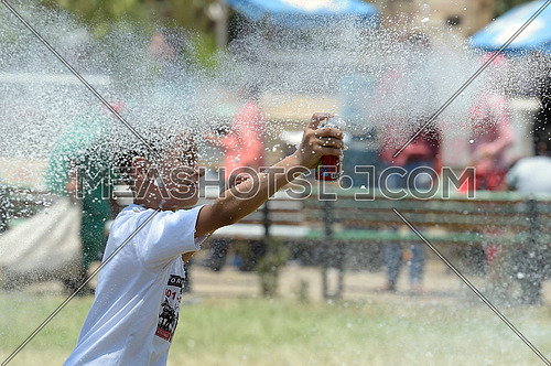 A child spraying white foam during eid al fitr celebration on 7 july 2016