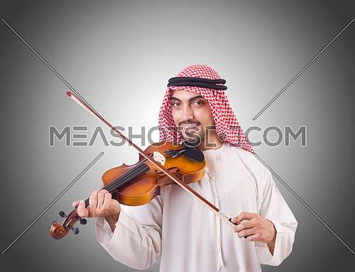 Arab man playing music on white