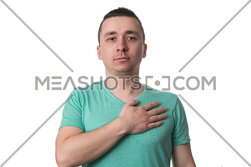 Man With His Hand On Heart Taking An Oath - Isolated On White Background