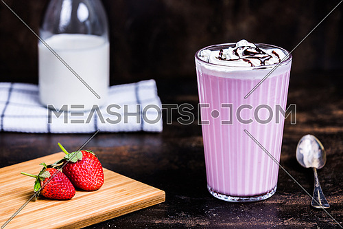 Strawberry Milk drink with whipped cream and chocolate syrup