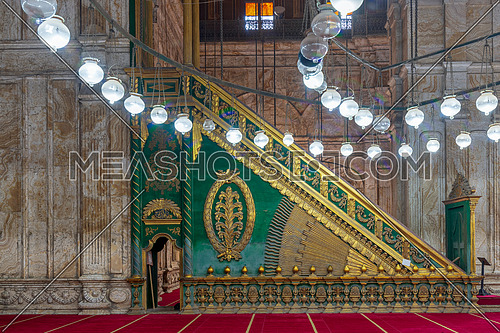 Decorated alabaster (marble) wall with green wooden platform (Minbar) at the great Mosque of Muhammad Ali Pasha (Alabaster Mosque), situated in the Citadel of Cairo in Egypt