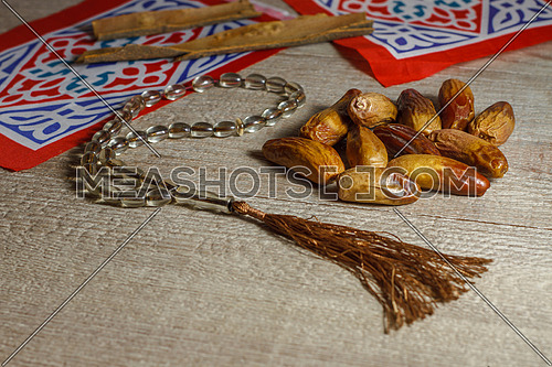 Dates and Ramadan Decorations on a wooden table top