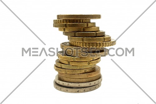 Stack of coins isolated on white background, viewed side on low angle