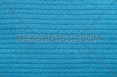 Close up background texture of pastel blue cable knitted wool jersey fabric sweater with row braid pattern