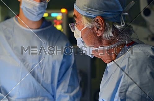 doctors performing procedure in operating room