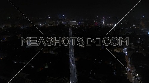 Reveal shot flying over downtown showing Cairo and The River Nile - 1st MAY 2019 - at night
