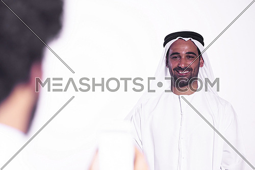 middle eastern business man taking portrait photos with phone