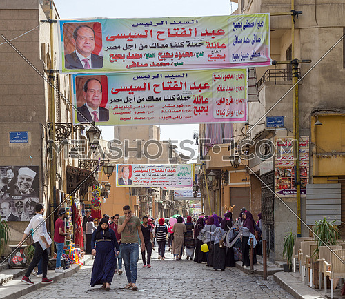 Cairo, Egypt - March 25, 2018: Banners supporting current Egyptian president Abdel-Fattah El-Sisi for a second term for the presidential elections at crowded Al Moez Street, Gamalia district