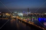 Timelaps by the nile and cairo tower from sunset to night showing vibrant city
