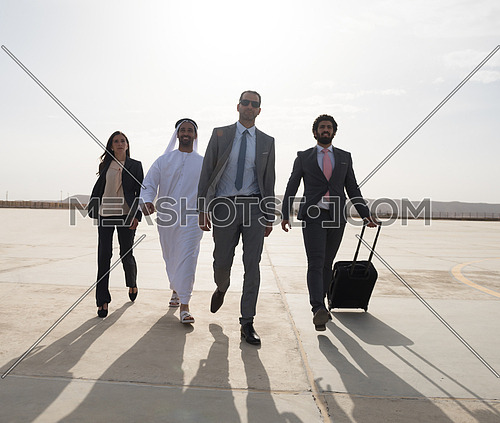 young successful middle eastern businessmen walking the runway with Arab business partner