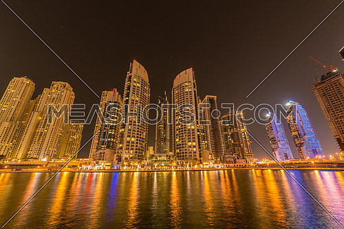 Dubai marina skyscrapers during night hours