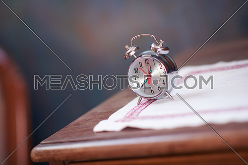 vintage retro old clock at wooden table
