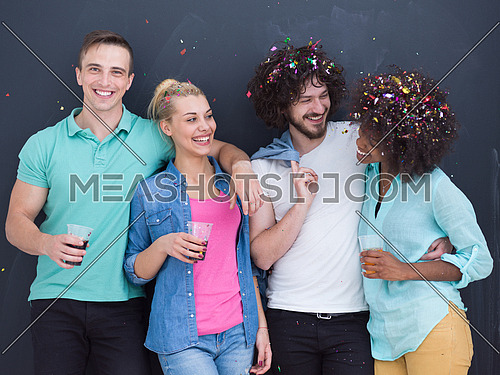 confetti party Multiethnics group of happy young people celebrating new year eve while dancing and have fun at home isolated over gray background