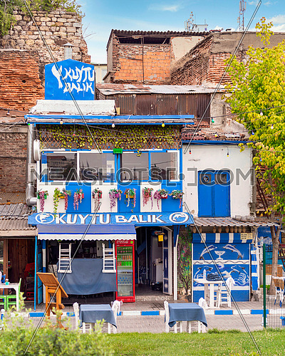 Traditional colorful seafood restaurant painted in blue and white, located in Beyoglu, Istanbul, Turkey