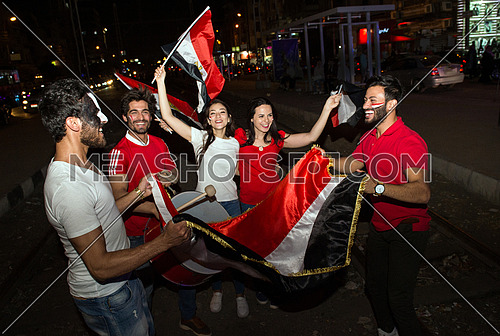 Some young people in the street are encouraging the Egyptian football team and the joy of their arrival at the World Cup in Russia
