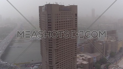 Fly Over Cairo city in Tahrir Area at Foggy Day.