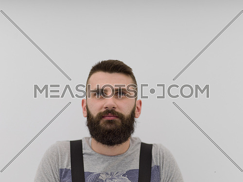 portrait of  young bearded hipster handyman isolated on white background