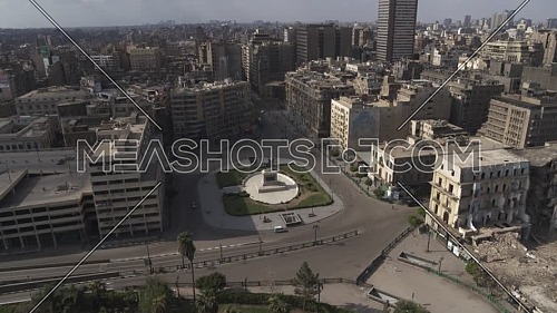 Aerial reveal shot for Ibrahim Pasha Statue at Opera Square in Cairo Downtown empty streets during the corona pandemic lockdown by day 10 April 2020
