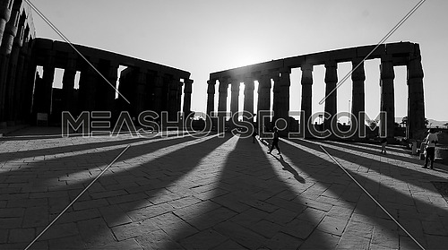 Sunset in the city of Luxor on Luxor Temple in black and white