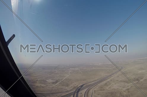 inside cockpit shot  flying toward runway at day