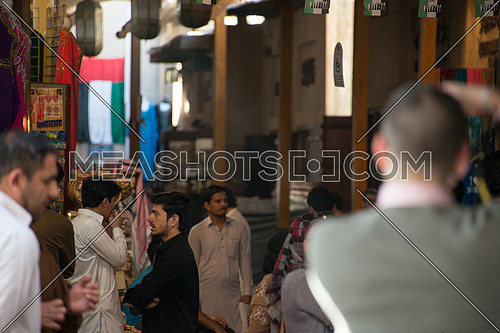 tourists and sellers at the grand bazzar in Dubai, UAE