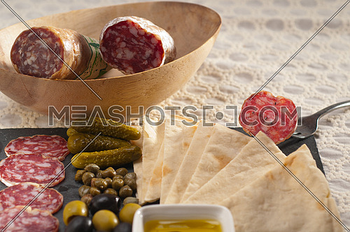 fresh cold cut platter with pita bread and pickles antipasti