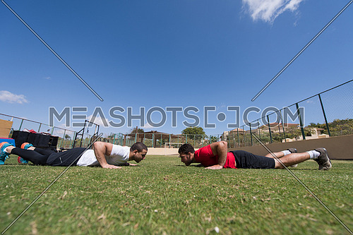 young middle eastern men athlete enjoys doing the extreme push-ups outside