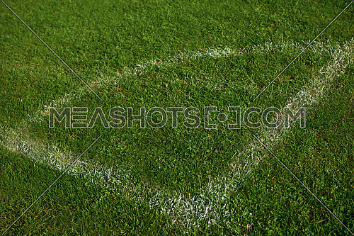 Corner of the soccer field green grass background