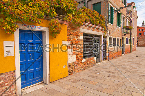 a blue door in the streets of venice