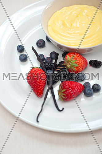 home made custard pastry cream and fresh  berries with vanilla seeds stick