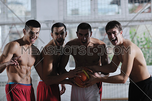 young and healthy people man have recreation and training exercise  while play basketball game at sport gym indoor hall