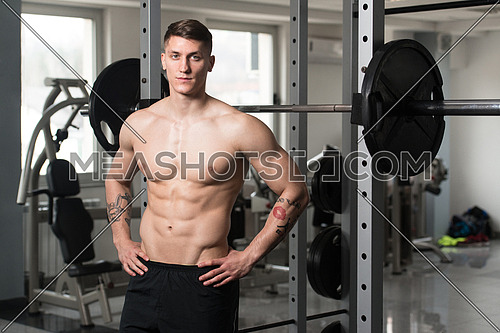 Good Looking And Attractive Young Man With Muscular Body Standing In Gym And Relaxing In Gym