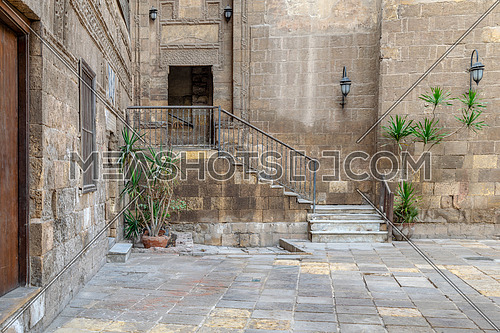 Courtyard of Prince Tax palace with staircase and entrance leading to the first floor located in Old Cairo, Egypt