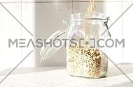 Grain of barley malt  in a jar