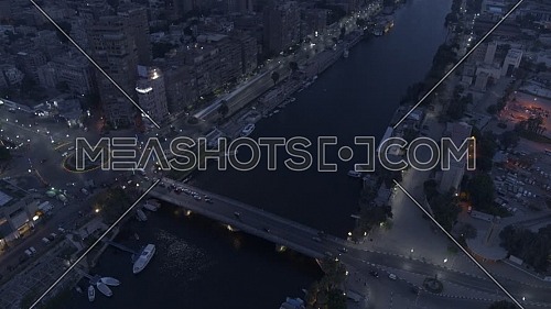 Flying over AL Galaa Bridge showing the River Nile, AL Galaa Square in Dokki Area in Cairo by early morning - 3rd of May 2020