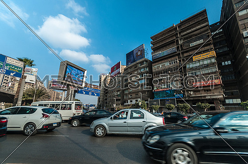 long shot for traffic in Gamet Al Dowal Street at Cairo at Day